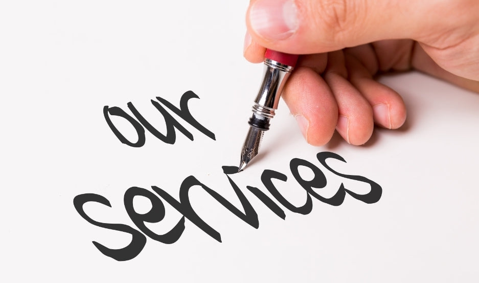 ecriture "our services" à l'encre sur papier